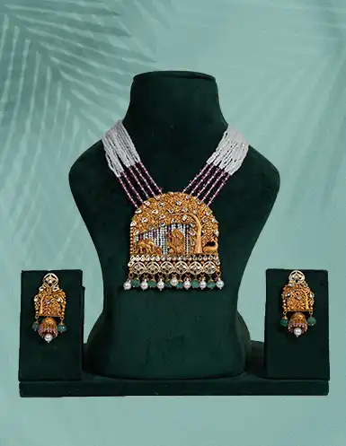 Gold and emerald bridal necklace set with matching earrings